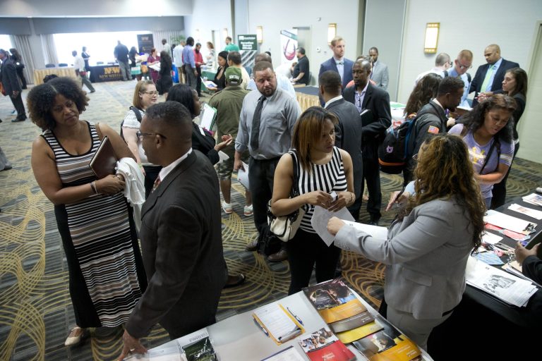 In this June 23, 2014 photo, job seekers and recruiters meet during a job fair in Philadelphia. The Labor Department releases weekly jobless claims on Thursday, June 26, 2014. (AP Photo/Matt Rourke)