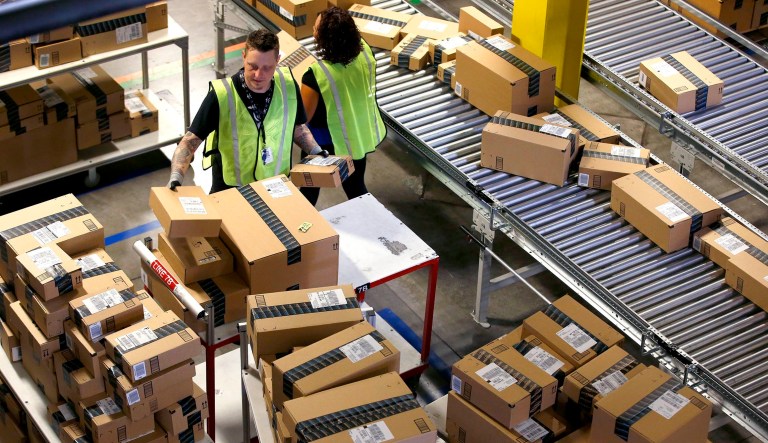 In many places, Amazon locates a depot near a post office, presorts the packages, and delivers them to the post office. (AP Photo/Ross D. Franklin, File)