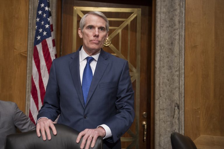 Senate Homeland Security and Governmental Affairs Permanent subcommittee Chairman Sen. Rob Portman, R-Ohio waits to open a subcommittee hearing into Backpage.com knowing facilitation of online sex trafficking, Tuesday, Jan. 10, 2017, on Capitol Hill in Washington. (AP Photo/Cliff Owen)
