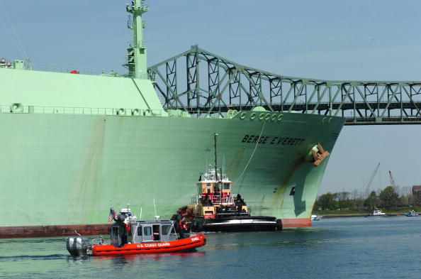 BOSTON - MAY 8:  In this handout from the U.S. Coast Guard, a U.S. Coast Guard boat helps the  Liquified Natural Gas container ship Berge Everett as it comes inbound May 8, 2006 in Boston, Massachusetts.  (Photo by Kelly Turner/U.S. Coast Guard via Getty Images)
