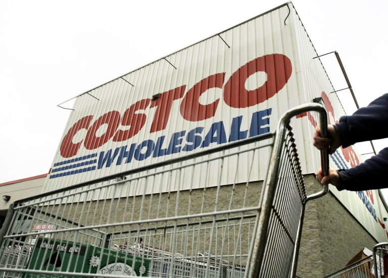 FILE - A shopper pushes a cart outside Costco Wholesale in Danvers, Mass. in this May 27, 2009 file photo. Costco's fiscal second-quarter net income fell 15 percent, hurt by softer sales of some non-food items, weaker gross margins in its fresh foods business and the impact of weaker foreign currency exchange rates on its international results. Its latest performance missed Wall Street's view. The stock declined in premarket trading on Thursday March 6, 2014. (AP Photo/Elise Amendola, File)