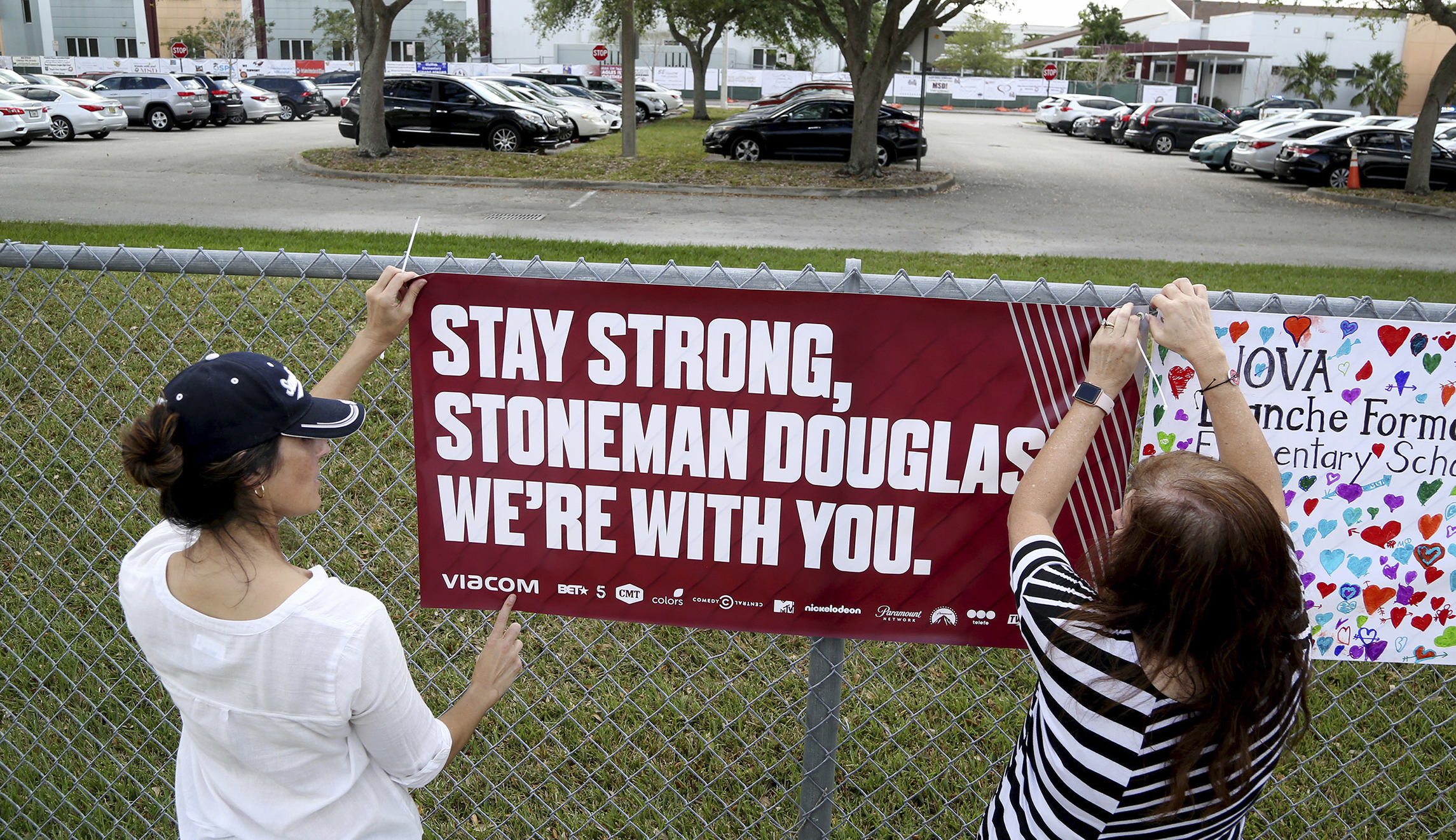 Students return to Florida high school two weeks after shooting