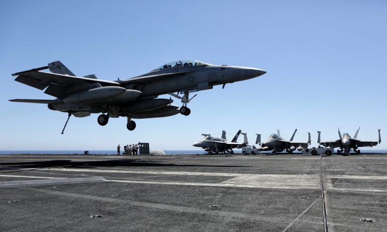 A former Chinese businessman was sent to prison for conspiring to steal sensitive U.S. military data, some relating U.S. military fighter jets. (AP Photo/Bram Janssen)