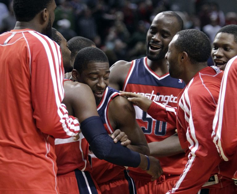 Don Ryan/AP
Jordan Crawford's 3-pointer as time expired gave the Wizards their fifth win in seven games.