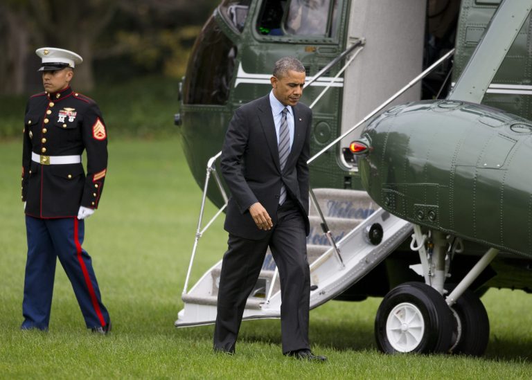 President Barack Obama walks from the Marine One helicopter on the South Lawn of the White House in Washington, Tuesday, Nov. 5, 2013, to the Oval Office after a trip to Walter Reed National Military Medical Center to visit with wounded troops. (AP Photo/ Evan Vucci)