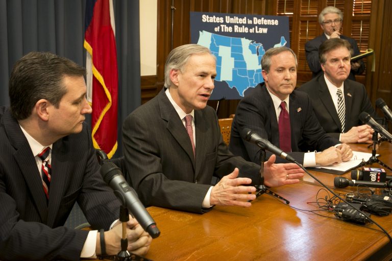 From left to right, Texas Sen. Ted Cruz, Gov. Greg Abbott, Attorney General Ken Paxton and Lt. Gov. Dan Patrick talk about President Obama's immigration executive order at a news conference at the Capitol in Austin, Texas, Wednesday, Feb. 18, 2015. (AP Photo/Austin American-Statesman, Jay Janner)
