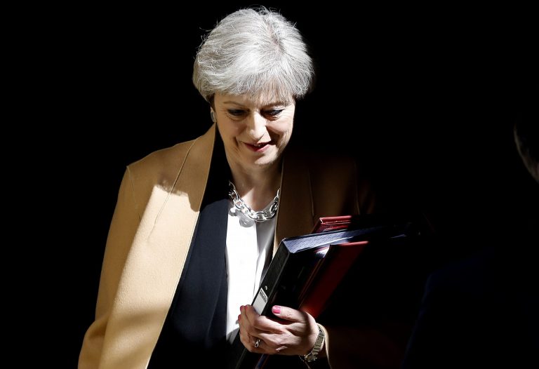 British Prime Minister Theresa May leaves 10 Downing Street in London, to attend Prime Minister's Questions at the Houses of Parliament on April 19. (AP Photo/Frank Augstein)