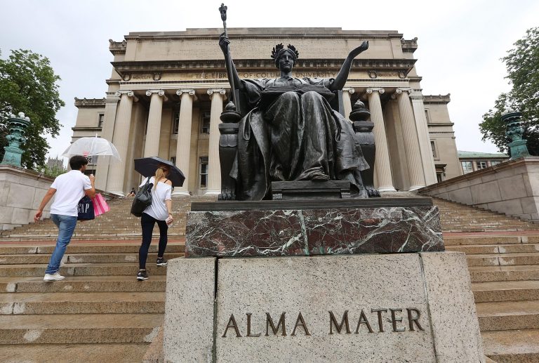 People walk on the Columbia University campus on July 1, 2013 in New York City. (Getty File Photo)