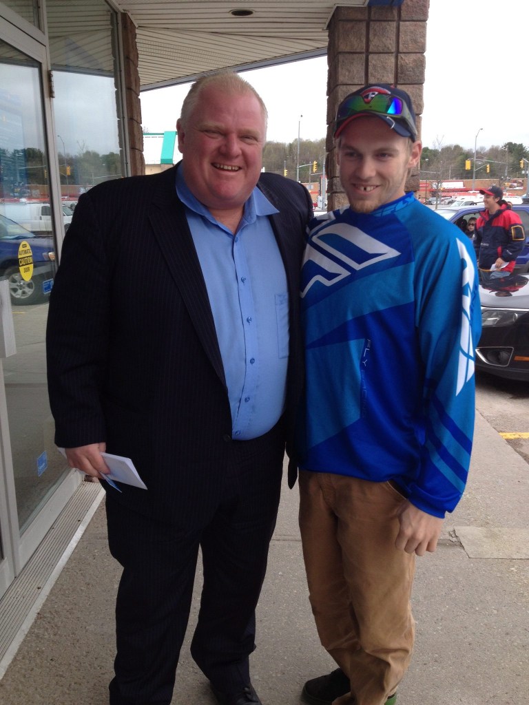 In this photo provided by Brody Lisle, Toronto Mayor Rob Ford poses for a photo with him in Bracebridge, Ontario, Canada on Friday, May 16, 2014. Ford is still in rehab, his lawyer said Friday as photos of the mayor posing with residents in Ontario's cottage country were posted online. 