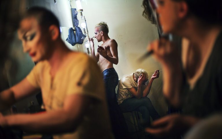 In this photo taken Saturday, Feb. 8, 2014, performers get ready backstage before a performance at the Mayak cabaret, the most reputable gay club in Sochi, Russia, host to 2014 Winter Olympics. Russia adopted a law last year, prohibiting vaguely defined propaganda of non-traditional sexual relations and pedophilia. The legislation makes it illegal to disseminate information to children even if it merely shows that gay people are just like everybody else. At Mayak, packed on Saturday night, gay men and women steered away from discussing the law, preferring to enjoy life, closeted as it is. About a hundred people were chatting at the bar, sitting in armchairs or dancing. Couples were sharing kisses. Everyone was waiting for the club's specialty: a drag show. At 1.30 a.m. on Sunday, the music stopped and the show began. (AP Photo/David Goldman)