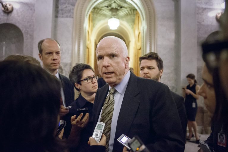 Sen. John McCain, R-Ariz., speaks to reporters as he leaves the Senate chamber after a roll call vote, at the Capitol in Washington, Wednesday, Nov. 12, 2014. (AP Photo/J. Scott Applewhite)