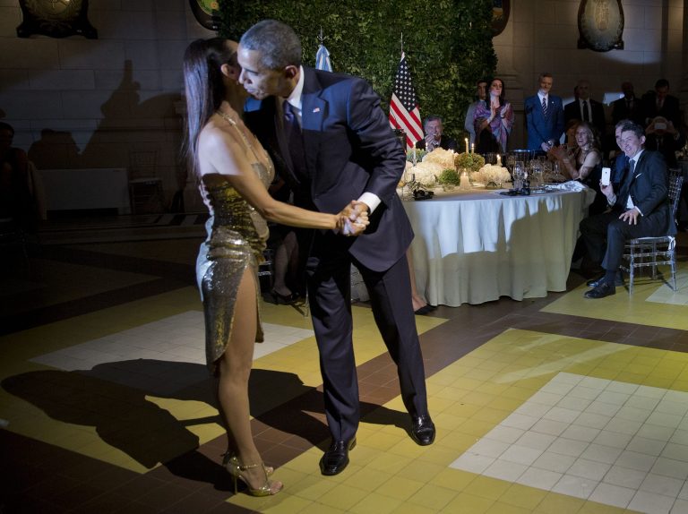 President Barack Obama kisses the dancer after doing the tango with her during the State Dinner at the Centro Cultural Kirchner, Wednesday, March 23, 2016, in Buenos Aires, Argentina. (AP Photo/Pablo Martinez Monsivais)