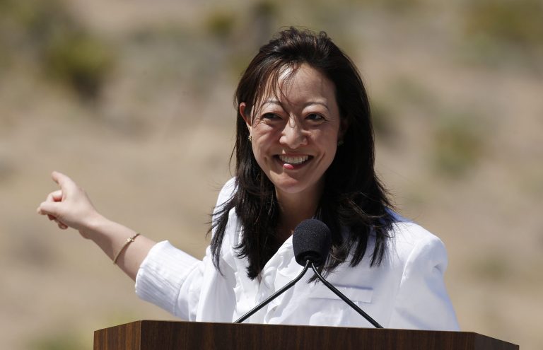 Assistant Interior secretary Rhea Suh helps First Lady Michelle Obama promote the 