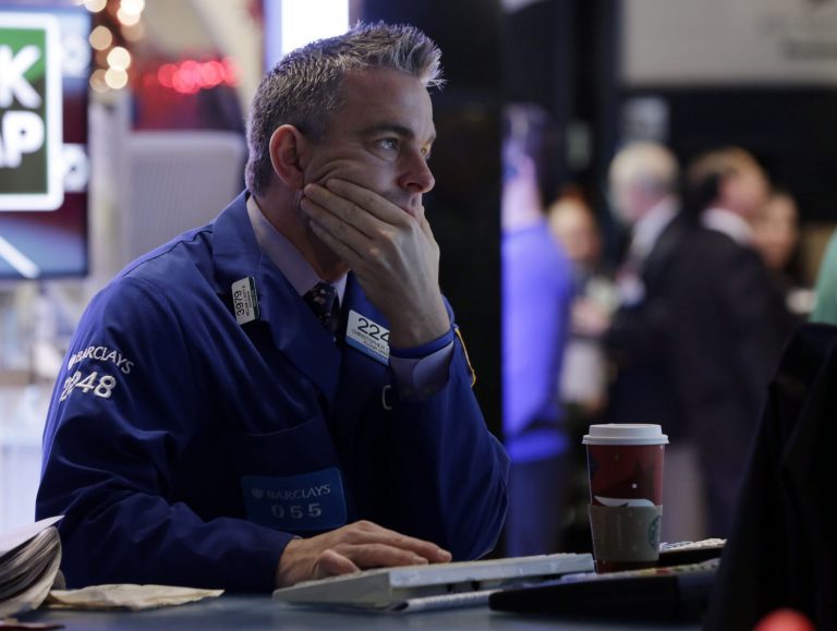   Specialist Christopher Culhane works at his post on the floor of the New York Stock Exchange Friday, Dec. 21, 2012. Stocks opened sharply lower Friday on Wall Street after Republicans in the U.S. House of Representatives called off a vote on tax rates and left federal budget talks in disarray 10 days before sweeping tax increases and government spending cuts take effect. (AP Photo/Richard Drew)  
