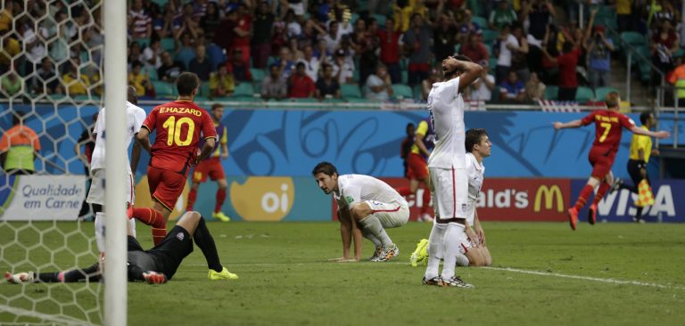 US players react after Belgium's Kevin De Bruyne, right,  scored the opening goal during the World Cup round of 16 soccer match between Belgium and the USA at the Arena Fonte Nova in Salvador, Brazil, Tuesday, July 1, 2014.  (AP Photo/Julio Cortez)