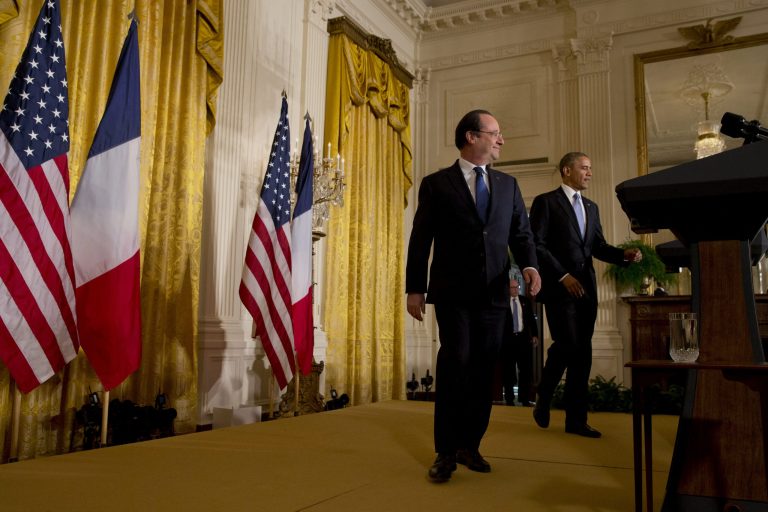 President Barack Obama and French President Francois Hollande arrive for their joint news conference in the East Room of the White House in Washington, Tuesday, Feb. 11, 2014. Lauding the 