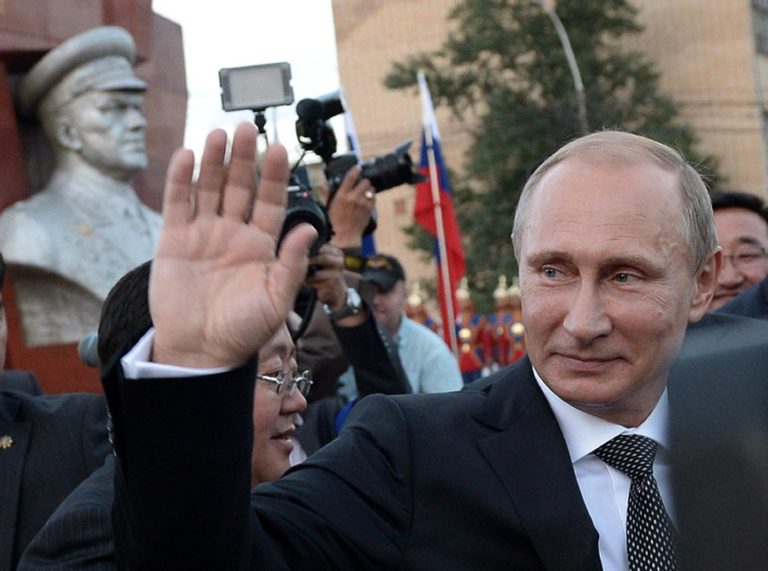 Russian President Vladimir Putin waves after a wreath laying ceremony at the monument to Soviet Marshal Georgy Zhukov in Ulan Bator, Mongolia, Wednesday, Sept. 3, 2014. A day ahead of a NATO summit, Russian President Vladimir Putin issued his own peace plan for eastern Ukraine, calling on the Russian-backed insurgents there to 