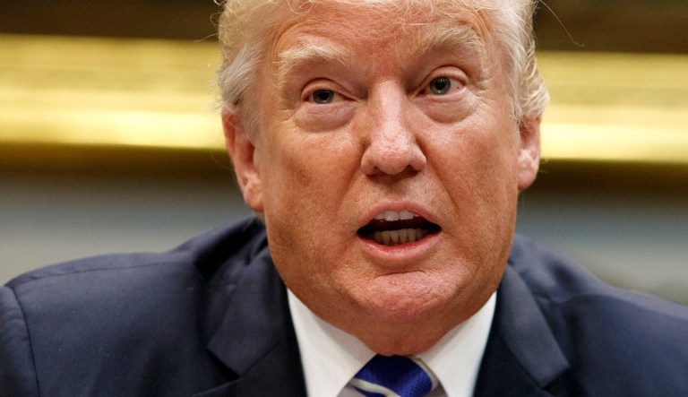 The day before the charges were announced, Trump suggested the forthcoming news was meant to distract Americans from GOP-led efforts to overhaul the tax system. (AP Photo/Evan Vucci)