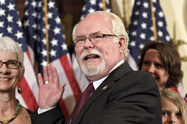 Rep. Ron Barber, D-Ariz., joined by his wife Nancy Barber, left, participates in a ceremonial swearing in to serve out the term of Rep. Gabrielle Giffords, D-Ariz., on Capitol Hill in Washington, June 2012. (AP Photo/J. Scott Applewhite)