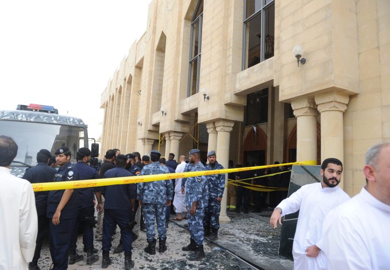 Security forces and officials gather at a Shiite mosque after a deadly blast claimed by the Islamic State group that struck worshippers attending Friday prayers in Kuwait City, Friday, June 26, 2015. (AP Photo)Â 