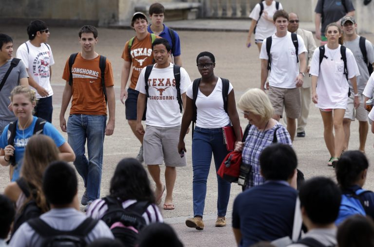 In this Thursday, Sept. 27, 2012 photo, students walk through the University of Texas at Austin campus in Austin, Texas.