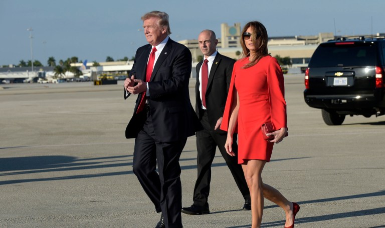President Trump is expected to spend Thanksgiving at his Mar-a-Lago resort in Palm Beach, Fla., and at the airport where Air Force One usually lands for such trips, wall-to-wall yellow school buses have been parked along the South Boulevard fence. (AP Photo/Susan Walsh)