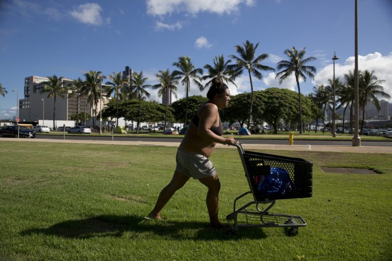 A 24-year-old homeless woman,Â Deja-Lynn Rombawa-Quarles,Â who worksÂ part-time at an elementary school, pushes her cart to do laundry at a nearby homeless encampment.Â Hawaii has the highest rate of homelessness in the United States, at 487 per 100,000 people, according to federal statistics.(AP Photo/Jae C. Hong)