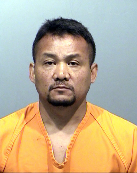 This photo released on April 29, 2014 by the Jefferson County District Attorney shows an undated booking photo of former Denver sheriff's division chief Michael Than.  Authorities say Than stole more than $20,000 worth of tax software by hiding it in other merchandise at Target stores. Court documents released Tuesday, April 29, 2014,  say Than hid boxes of Turbo Tax software in other items such as bags of dog food, a cooler and a padded envelope, then paid for those items instead. Investigators say he resold the software on eBay between February 2010 and January 2013, earning more than $60,000. Than was indicted on charges including tax evasion, theft and filing false tax returns.(AP Photo/Jefferson County District Attorney)