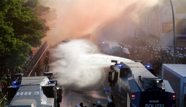 Police uses water canons during a protest against the G-20 summit in Hamburg, northern Germany, Thursday, July 6, 2017. The leaders of the group of 20 meet July 7 and 8. (AP Photo/Michael Probst)
