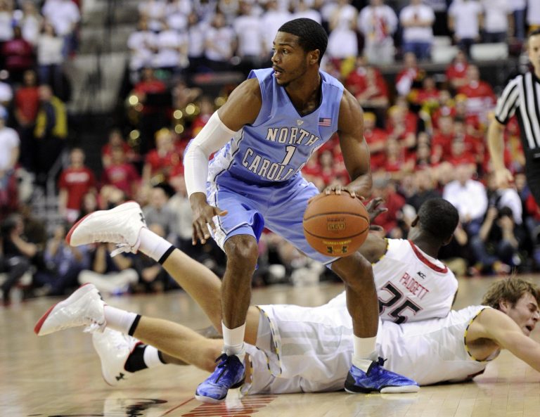 Nick Wass/AP
North Carolina guard Dexter Strickland dribbles around Maryland's James Padgett and Jake Layman as the Tar Heels downed the Terps 79-68.