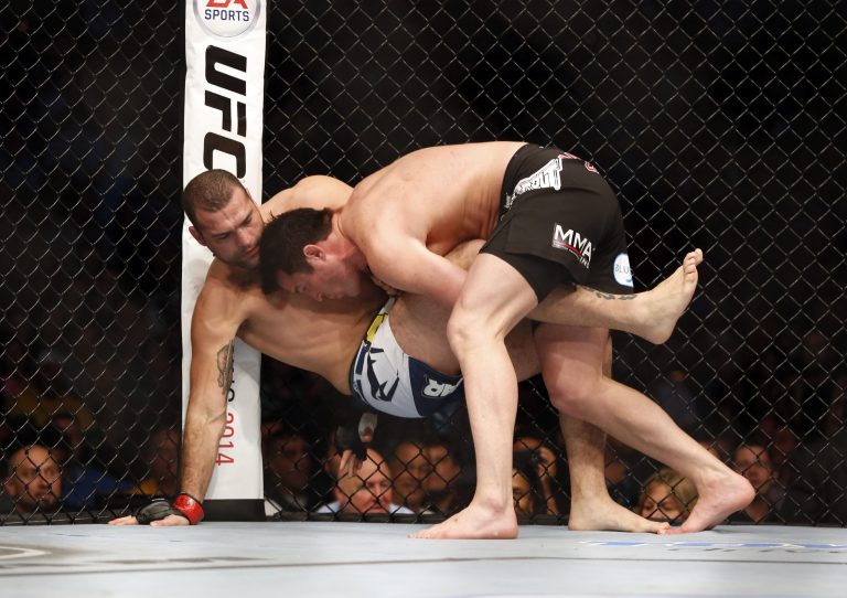 Mauricio 'Shogun' Rua, of Brazil, left, fights Chael Sonnen during their UFC on Fox Sports 1 mixed martial arts light heavyweight bout in Boston on Saturday. (AP/Gregory Payan)