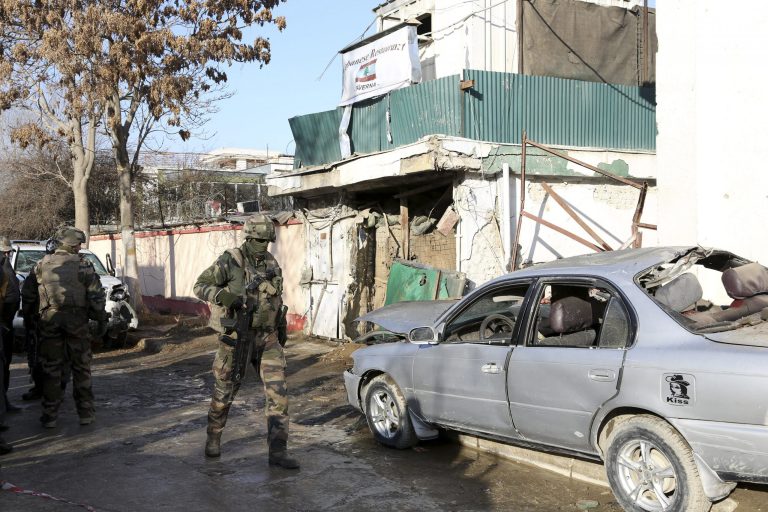 NATO International security assistance forces personnel investigate at the site of the Friday's suicide attack and shooting, in Kabul, Afghanistan, Saturday, Jan. 18, 2014. A Taliban suicide bomber and two gunmen on Friday attacked a Lebanese restaurant that is popular with foreigners and affluent Afghans in Kabul, a brazen attack that left 16 dead, including foreigners dining inside and two other gunmen, officials said. (AP Photo/Rahmat Gul)
