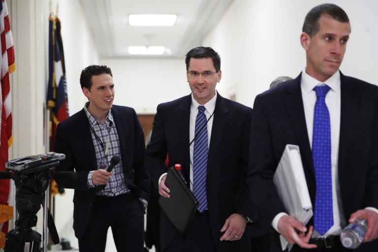 FBI Chief of Staff James Rybicki, center, who served former FBI Director James Comey, will leave for the corporate sector, FBI Director Christopher Wray announced Tuesday. (AP Photo/Jacquelyn Martin)