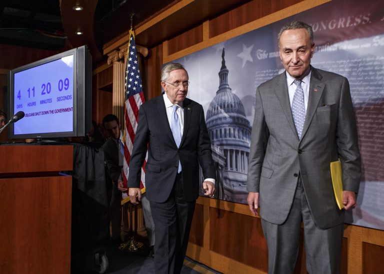   Senate Majority Leader Harry Reid of Nev., left, follows Sen. Charles Schumer, D-N.Y., right, the Democratic Policy Committee chairman, after a news conference on Capitol Hill in Washington, Thursday, Sept. 26, 2013, after blaming conservative Republicans for holding up a stopgap spending bill to keep the government running. Senate passage of the spending bill â stripped of the 