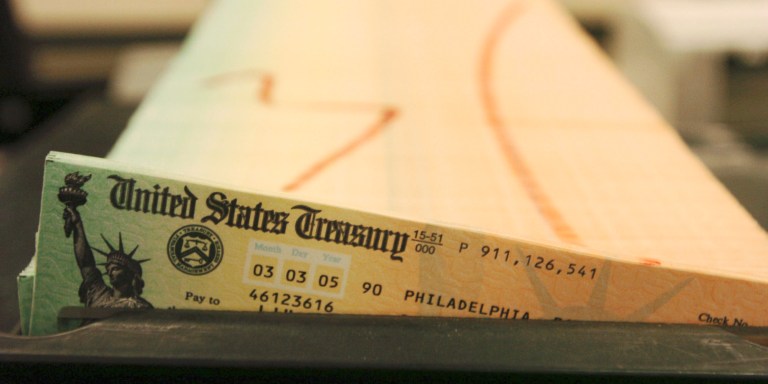 FILE - In this Feb. 11, 2005 file photo, trays of printed social security checks wait to be mailed from the U.S. Treasury's Financial Management services facility in Philadelphia.  For the second straight year, millions of Social Security recipients can expect an historically small increase in benefits come January 2014.  (AP Photo/Bradley C. Bower, File)