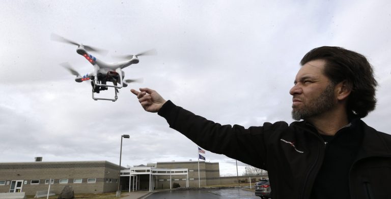 Jon McBride, who designs and builds drones with Digital Defense Surveillance, flies a training drone for members of the the Box Elder County Sheriff's Office search and rescue team, during a demonstration, in Brigham City, Utah. (AP Photo/Rick Bowmer)