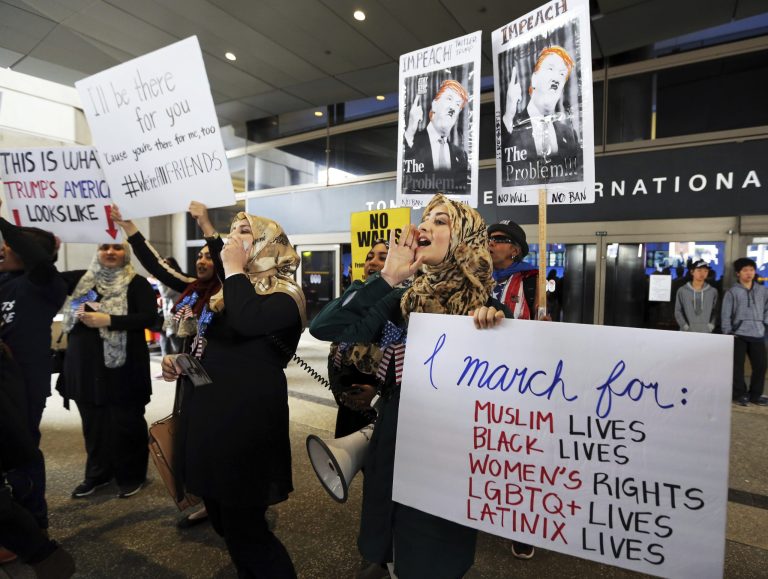 Protests at U.S. airports against President Trump and his travel ban has not scared off foreign visitors. (AP Photo/Reed Saxon)