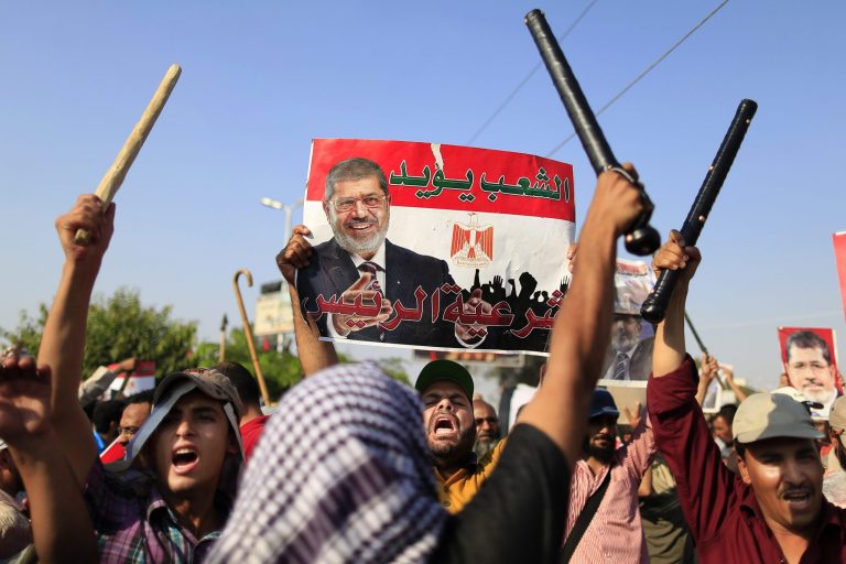 Supporters of Egypt's Islamist President Mohamed Morsi chant slogans during a rally, in Nasser City, Cairo, Egypt, on Thursday. (AP/Hassan Ammar)