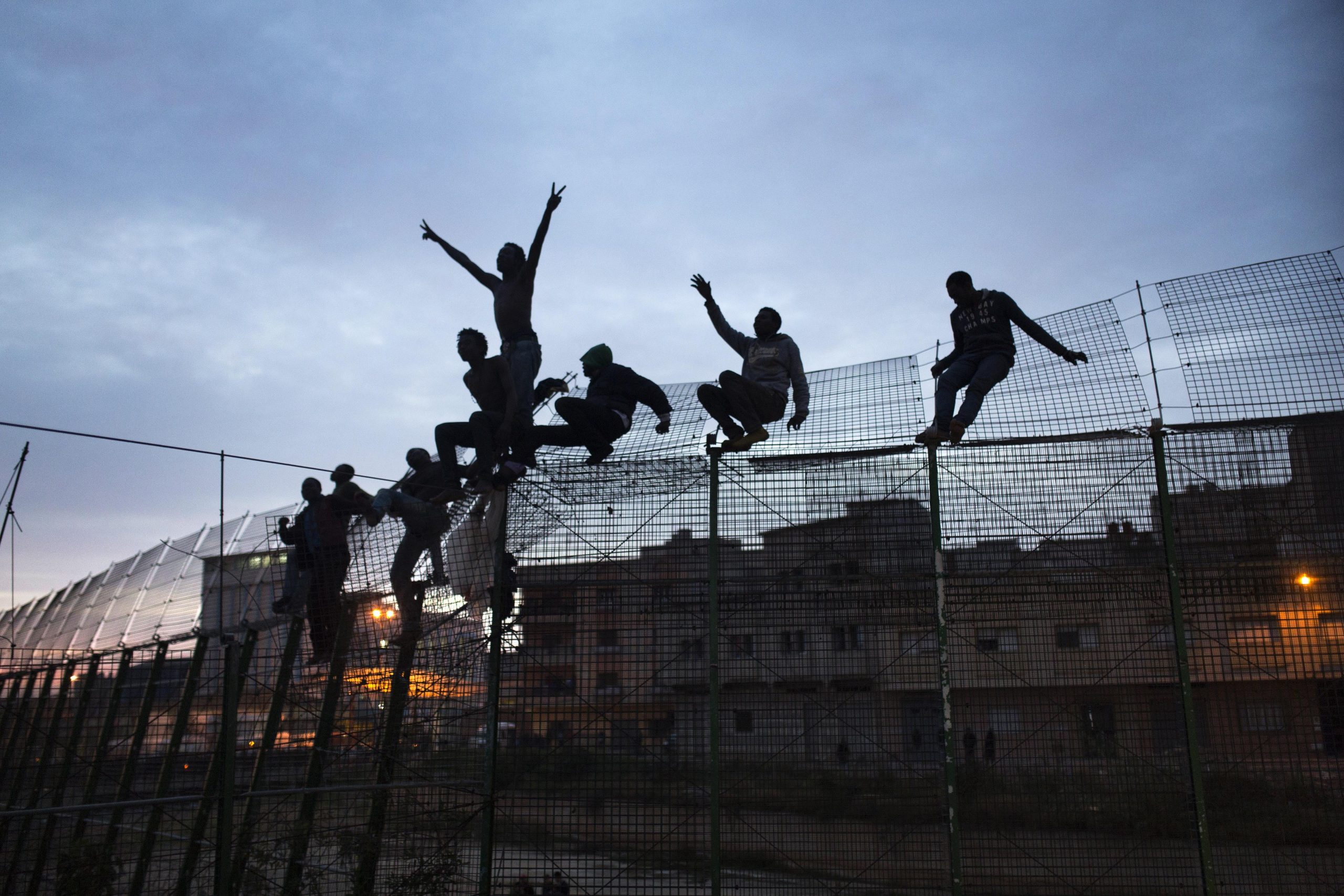 Hundreds of migrants try to enter Spanish enclave