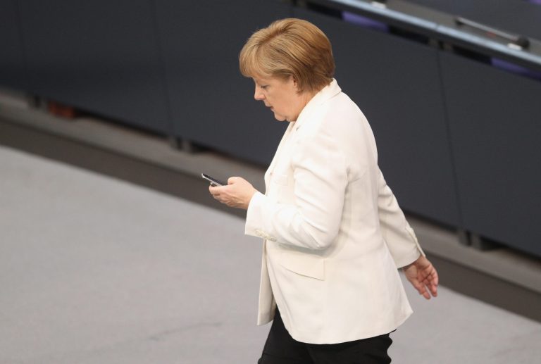 In this file photo German Chancellor Angela Merkel checks her mobile phone during a session of the Bundestag on June 29, 2012 in Berlin, Germany. German prosecutors announced Friday they have dropped their year-long investigation of the National Security Agency for allegedly spying on Chancellor Angela Merkel's mobile phone, citing a lack of evidence.Â (Photo by Sean Gallup/Getty Images)