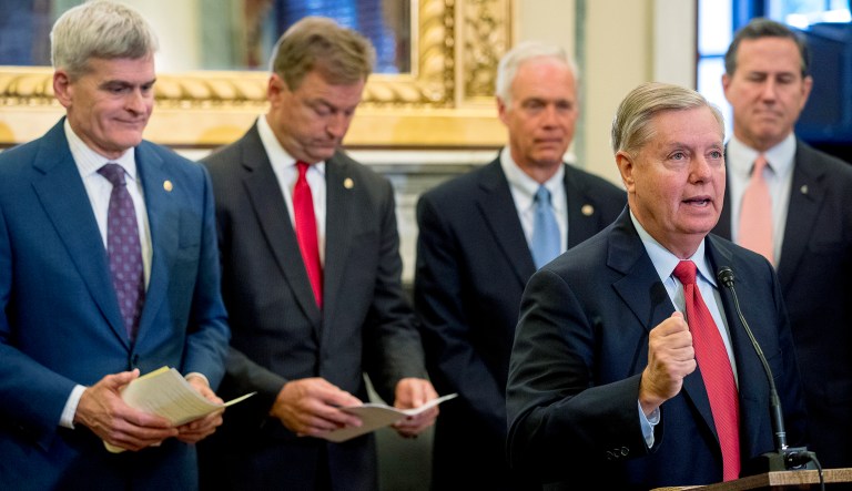 From left, Sen. Bill Cassidy, R-La., Sen. Dean Heller, R-Nev., Sen. Ron Johnson, R-Wis., Sen. Lindsey Graham, R-S.C., and former Sen. Rick Santorum, R-Pa., hold a press conference on Capitol Hill in Washington, Wednesday, Sept. 13, 2017, to unveil legislation to reform healthcare. (AP Photo/Andrew Harnik)