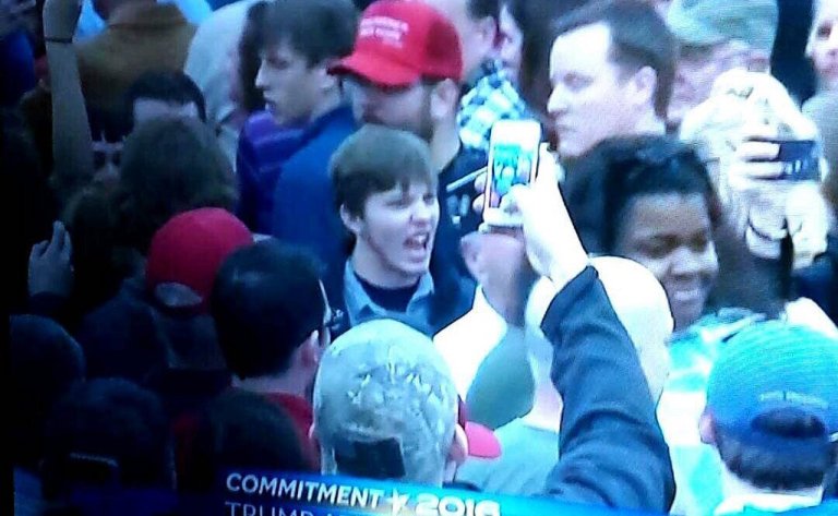 A black college student protesting at a Trump rally was assaulted by a group of white men. (Screengrab/Shaun King Twitter)