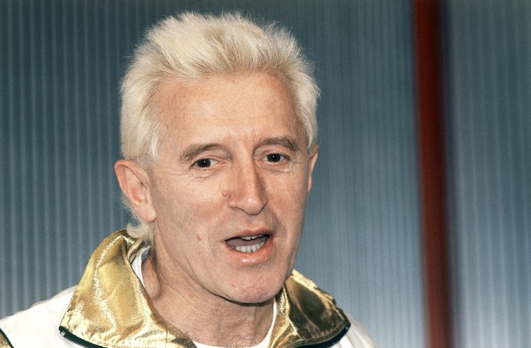 FILE - In this Dec. 17, 1986, file photo, Disc jockey and presenter on Britain's Radio 1, Jimmy Savile is pictured at Madame Tussauds museum in London, England. A British children's charity says at least 500 people have reported abuse by the late entertainer Jimmy Savile, with the youngest alleged victim just 2 years old. (AP Photo/John Redman, File)