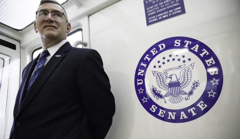 FILE-This Tuesday, June 3, 2014 file photo, Sen. John Walsh, D-Mont., leaves the Capitol in Washington. A campaign spokeswoman says Walsh is taking personal time at his Helena home but declined to answer questions about whether he plans to remain in the U.S. Senate race amid allegations that he plagiarized a research paper.  (AP Photo/J. Scott Applewhite,File)