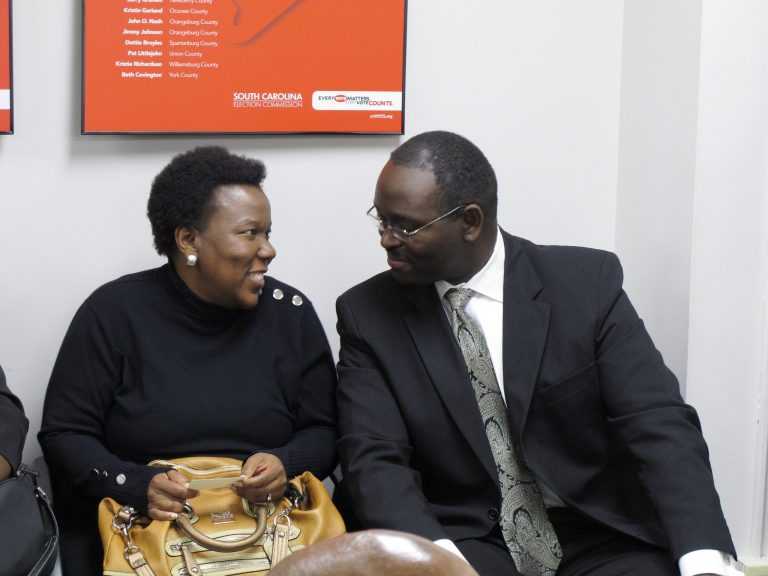 Â In this Tuesday, Nov. 26, 2012, file photo, state Sen. Clementa Pinckney, right, talks to a supporter during a break in a hearing protesting his re-election in Columbia, S.C. (AP Photo)Â 