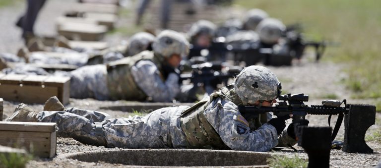 Female soldiers train on a firing range while wearing new body armor in Fort Campbell, Ky. (AP Photo/Mark Humphrey, File)
