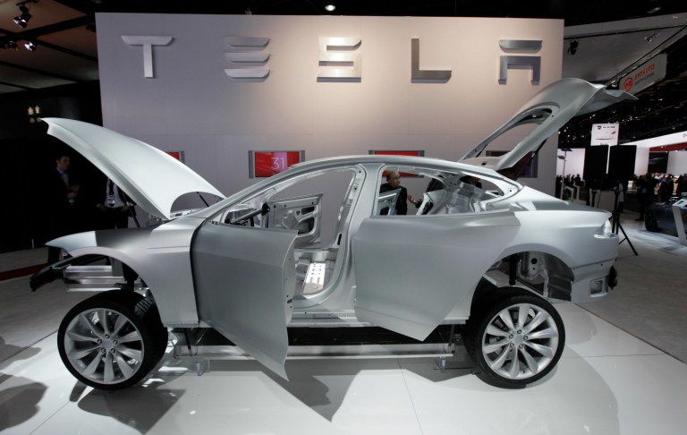 One of the sharpest brickbats too often tossed at Tesla Motors Inc. by free marketers and innumerable commenters on investment forums is that Chairman and CEO Elon Musk's crusade to build mass-market electric vehicles is just another exercise in crony capitalism. (AP Photo/Paul Sancya)