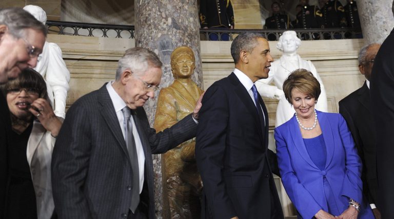 President Obama, flanked by Senate Majority Leader Harry Reid and House Minority Leader Nancy Pelosi unveil a statue of Rosa Parks in Statuary Hall of the United States Capitol Feb. 27, 2013 in Washington. (Olivier Douliery/Pool via CNP)