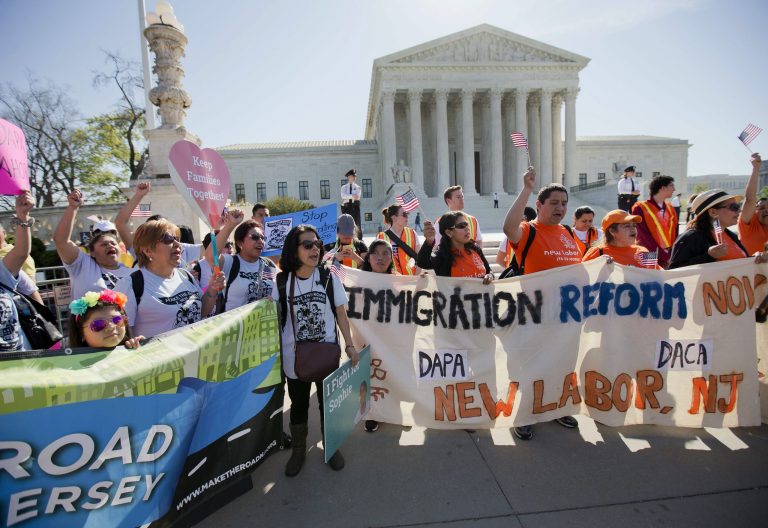 FILE - In this April 18, 2016 file photo, supporters of fair immigration reform gather in front of the Supreme Court in Washington. Republican presidential candidate Donald Trump's aggressive rhetoric on illegal immigration has obscured what may ultimately be a policy detour, the Republican presidential nominee is the first major party candidate in modern memory to propose limiting legal immigration. (AP Photo/Pablo Martinez Monsivais, File)