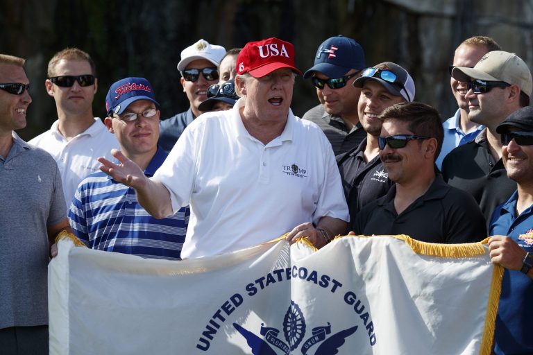 President Donald Trump speaks as he meets with members of the U.S. Coast Guard, who he invited to play golf, at Trump International Golf Club, Friday, Dec. 29, 2017, in West Palm Beach, Fla. (AP Photo/Evan Vucci)